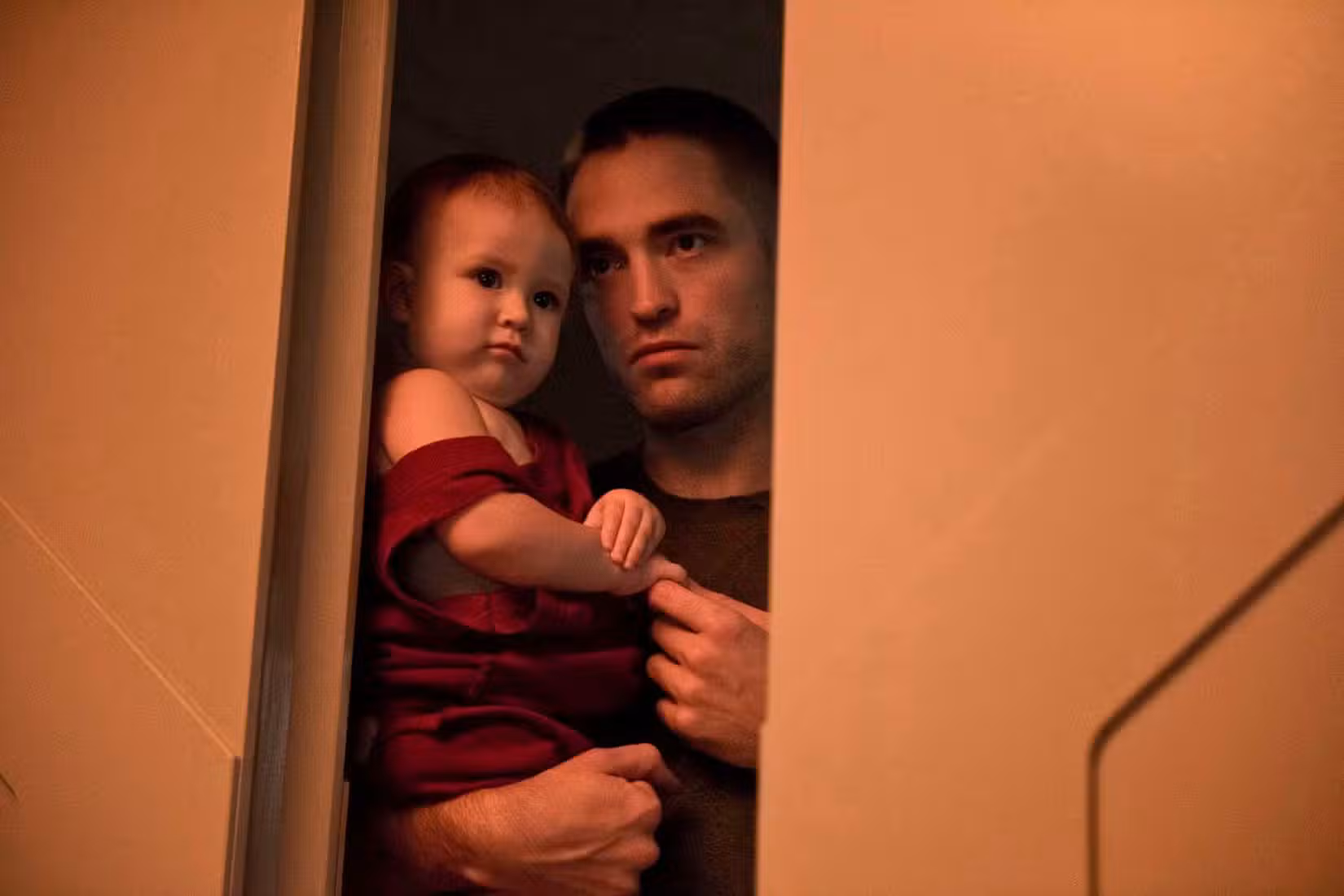 Monte holds his daughter Willow in High Life