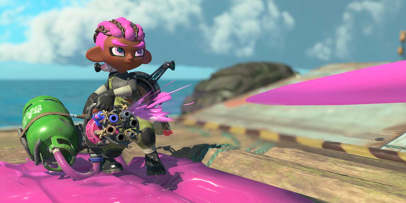 An Inkling with braids shoots a paint minigun