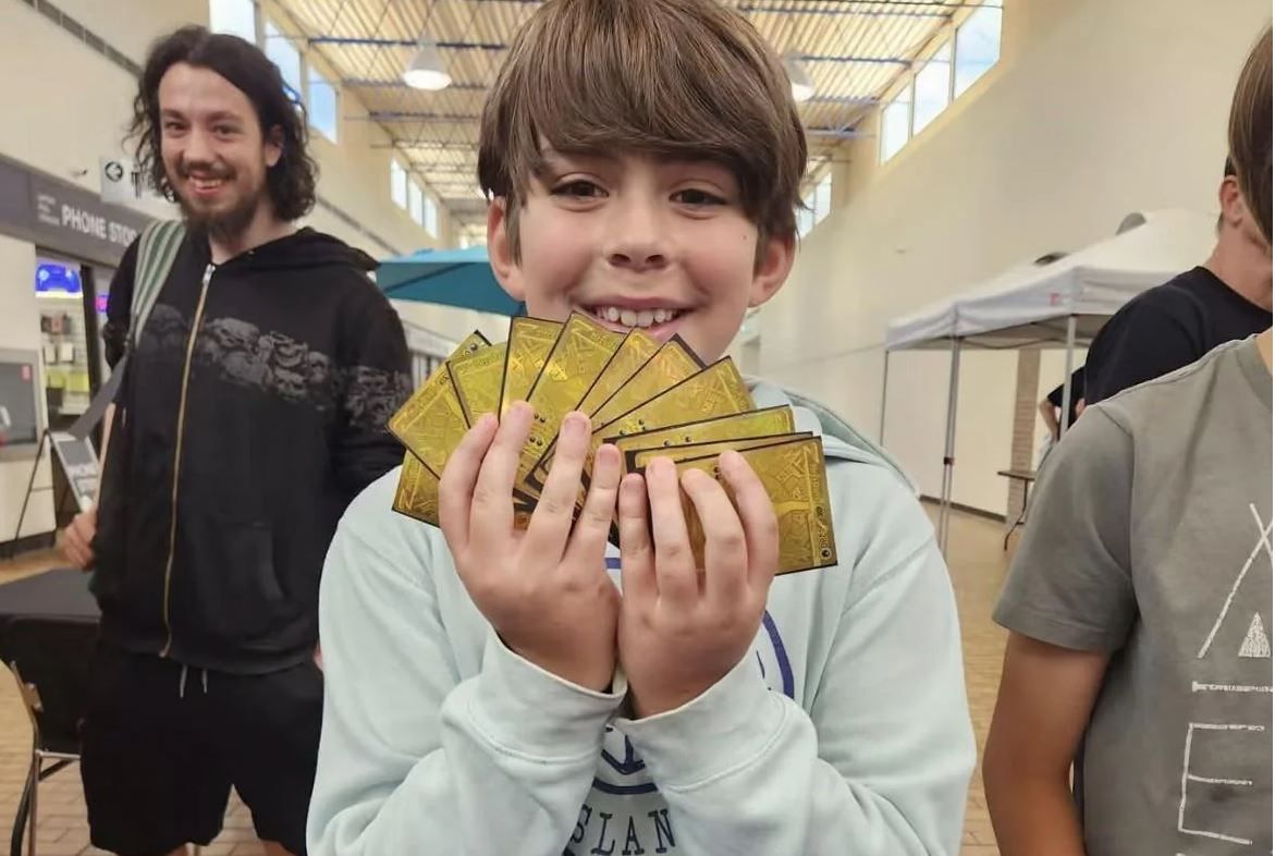 Canadian boy pulls world's first gold god pack from Pokémon Pitch Black