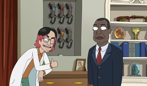 A guy wearing a lab coat winks at President Curtis and gives him the thumbs up while leaning on a desk near a rack of phones with odd logos.
