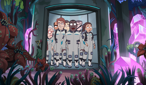 President Curtis, Banks, O'Doyle and others wearing explorer suits stand in an elevator looking at a subterranean world filled with weird plants and growing crystals in President Curtis