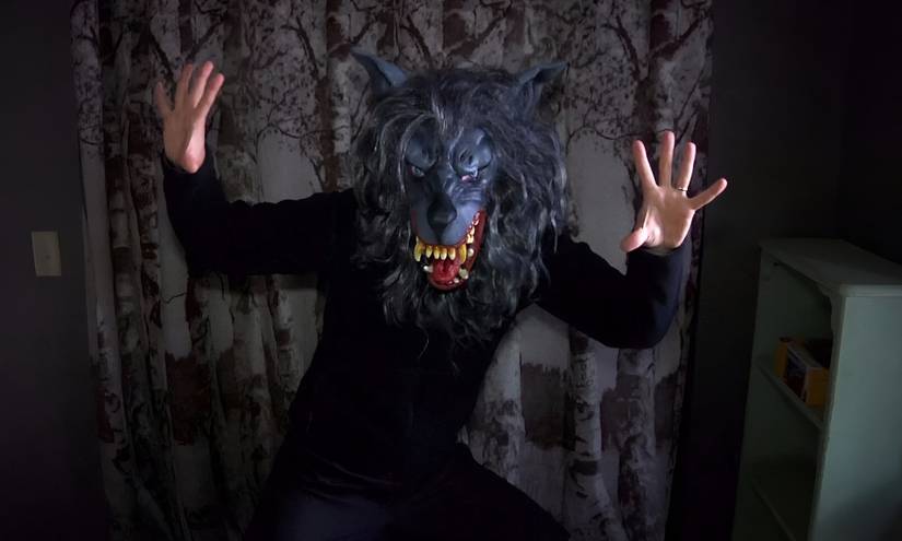 Josef dons a wolf mask and poses in Creep