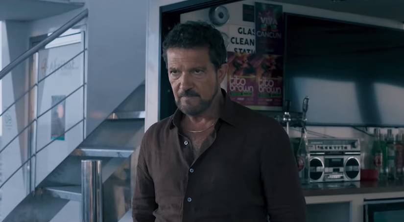 Antonio Banderas wearing a brown shirt in Above & Below