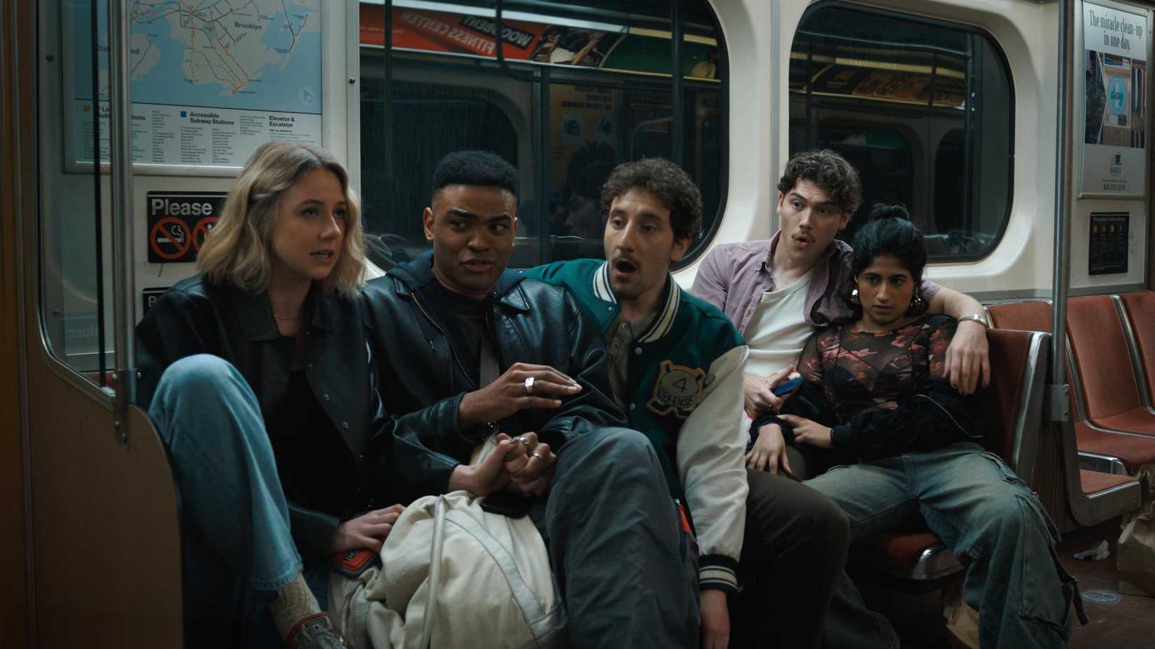 A group of friends riding the New York subway in Adults