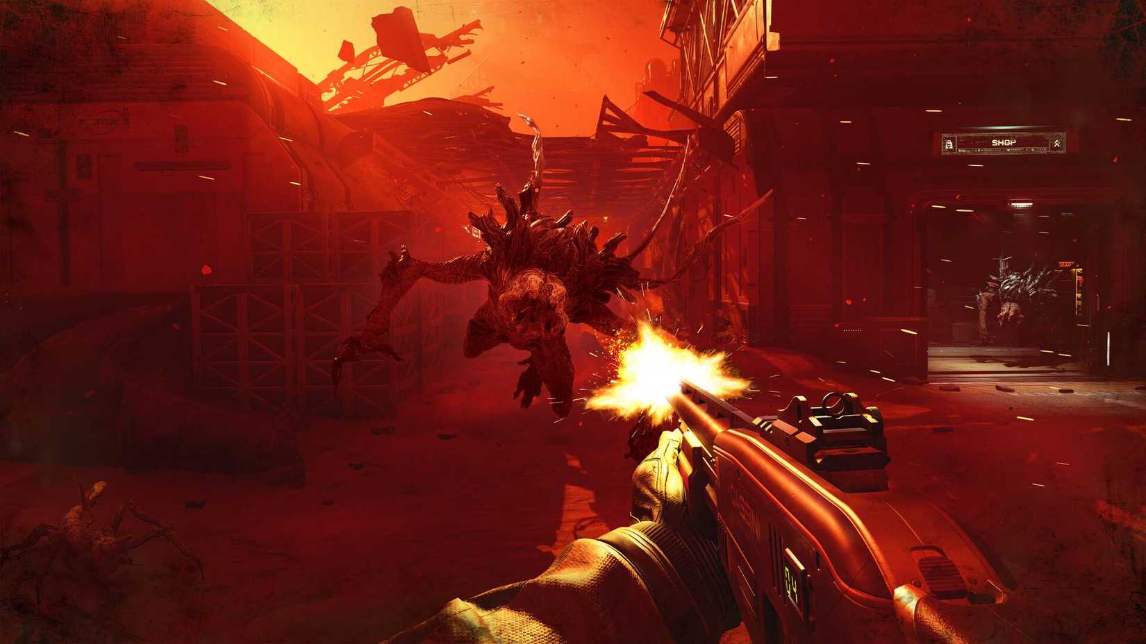 The player in Alien Deathstorm firing a gun at an alien leaping at them.