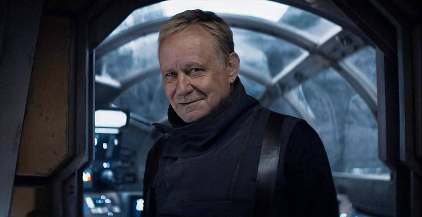 Luthen Rael smiles at Cassian in Andor