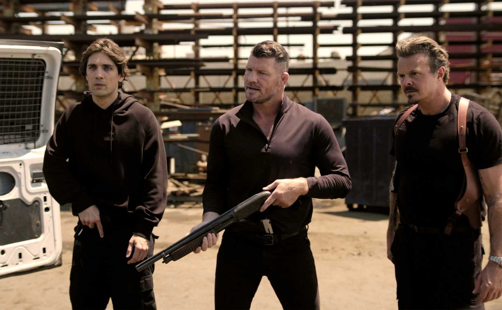 Three guys with guns wearing black in Atlas King