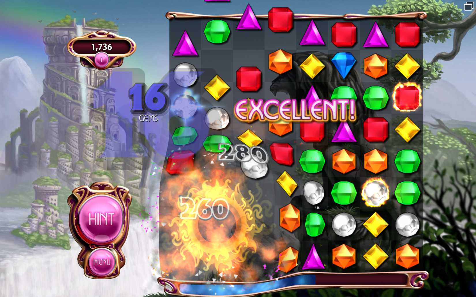 An explosion on a board of gems in Bejeweled, with the word EXCELLENT across it