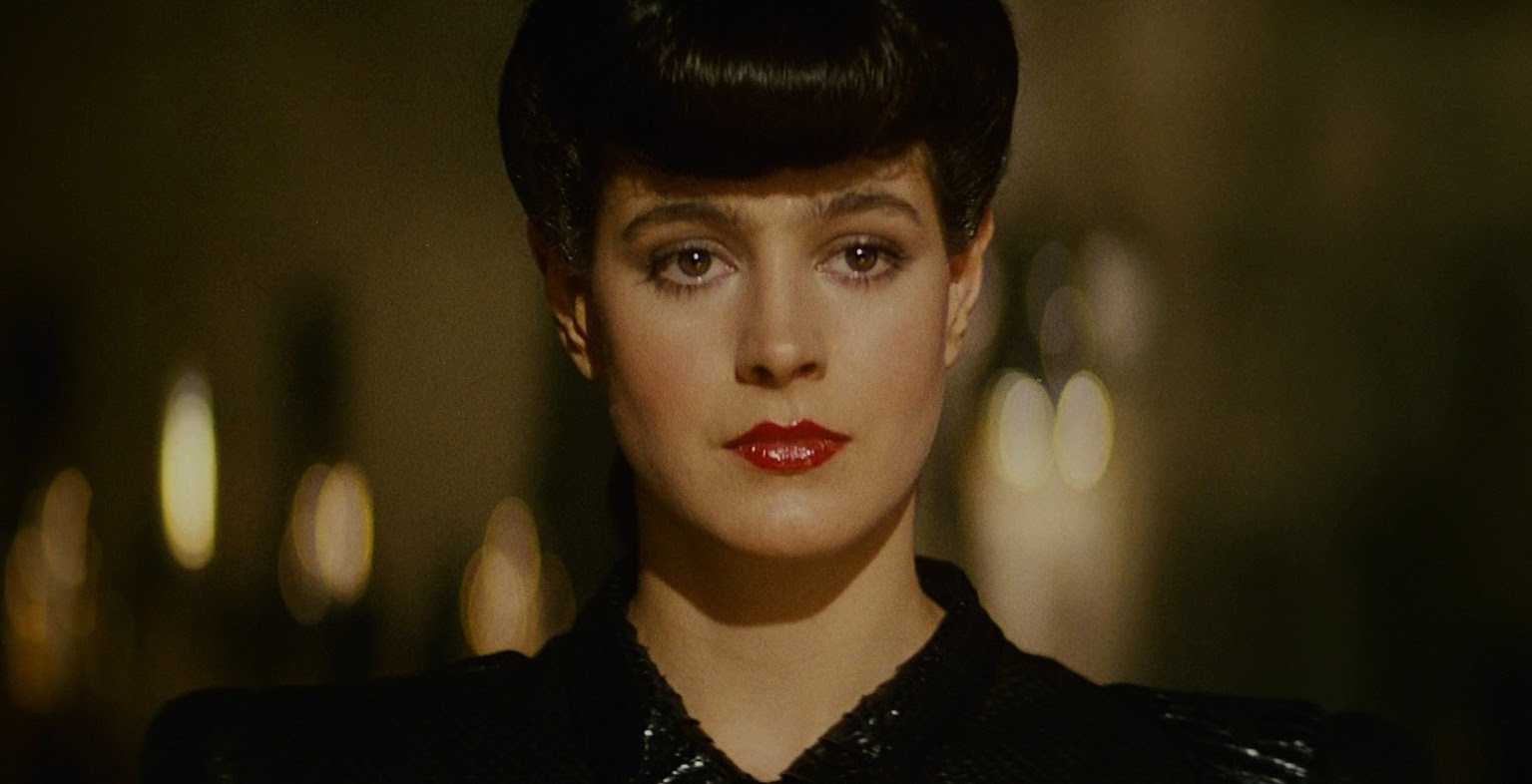 Rachael looks at Deckard during their first meeting in Blade Runner