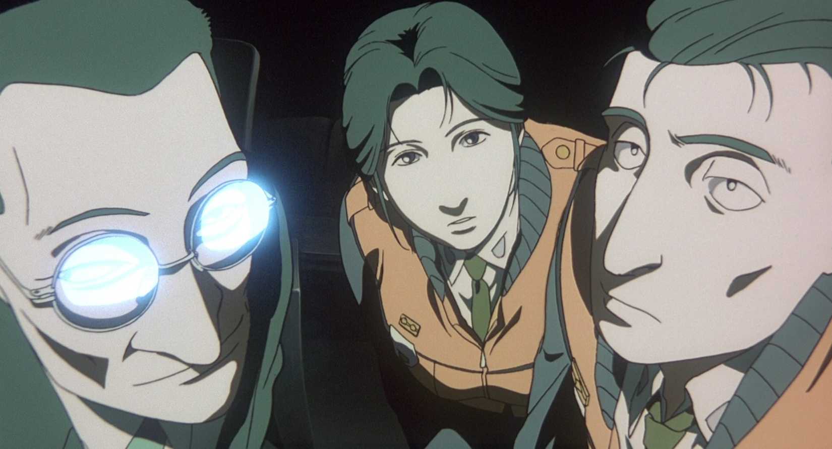 Three government officials lean and look ahead in Patlabor 2