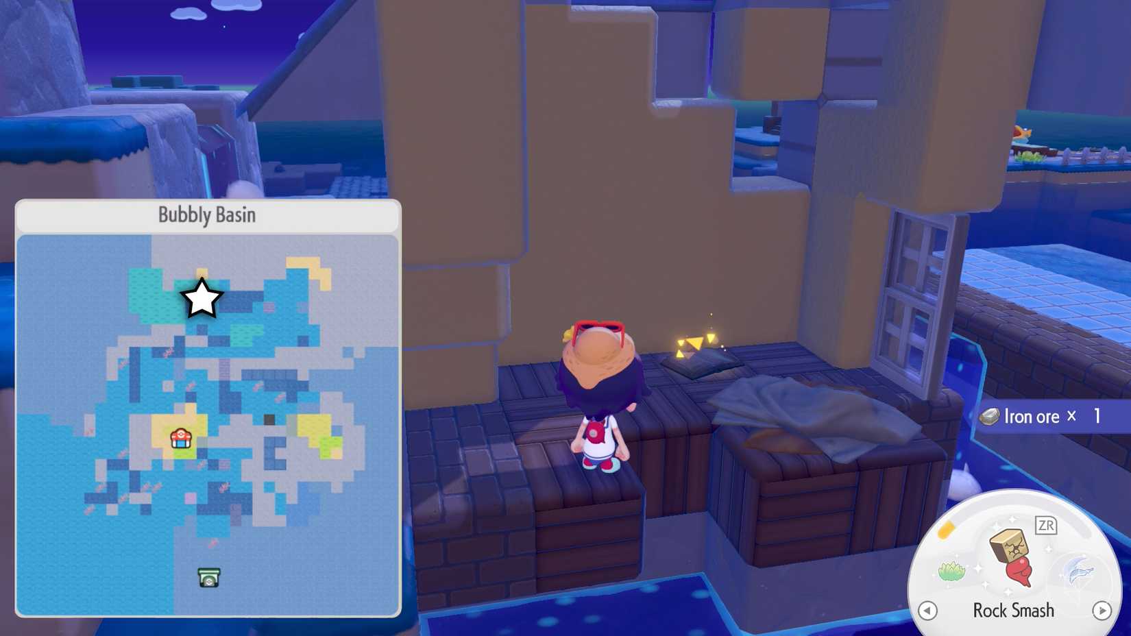 Ditto approaches a glowing book in a broken half of a building in Pokopia