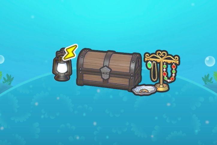 A treasure chest next to some jewelry and a lit lantern in Pokopia