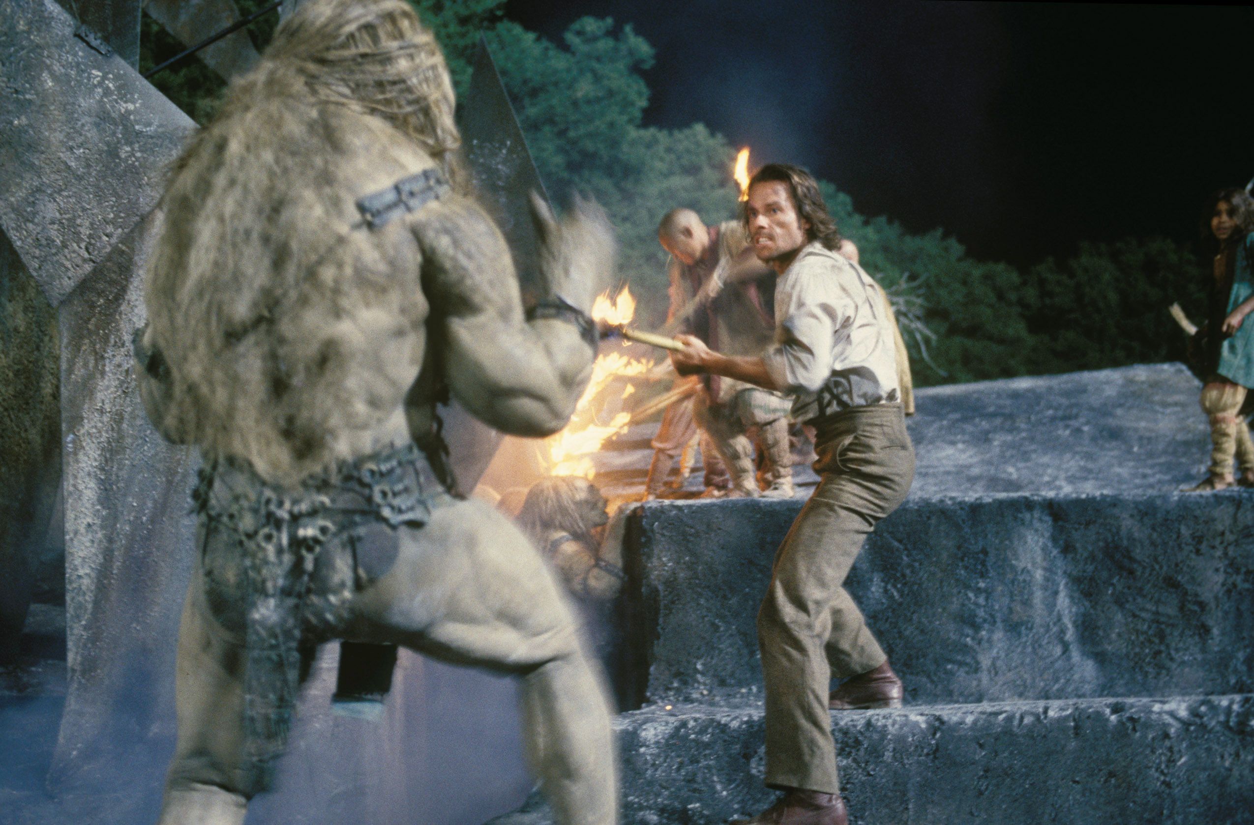 guy pierce fends off a morlock in the time machine (2002)