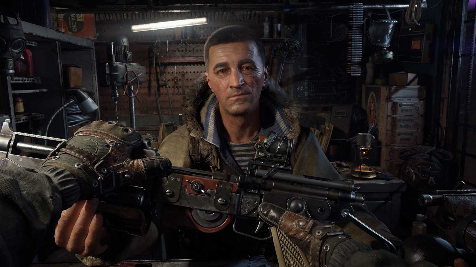 With a grim expression, the Armorer stands in his workshop and hands a weapon to the player.
