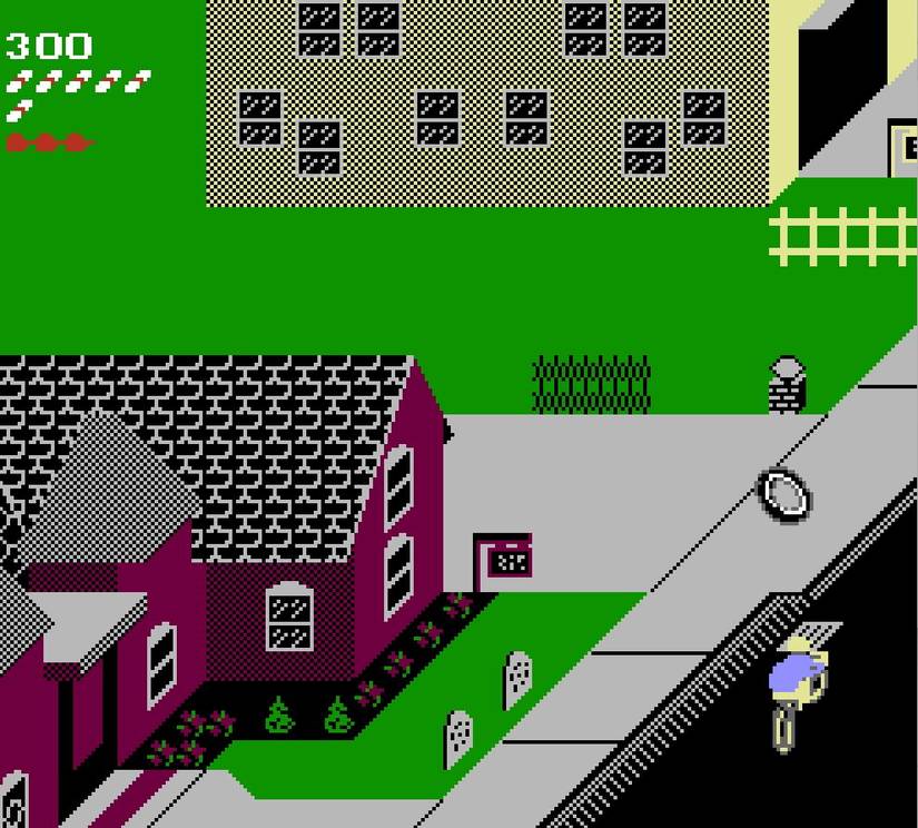 In the Paperboy demo, the paperboy rides down the street past a non-subscriber's red house as an inner-tube rolls along the sidewalk.
