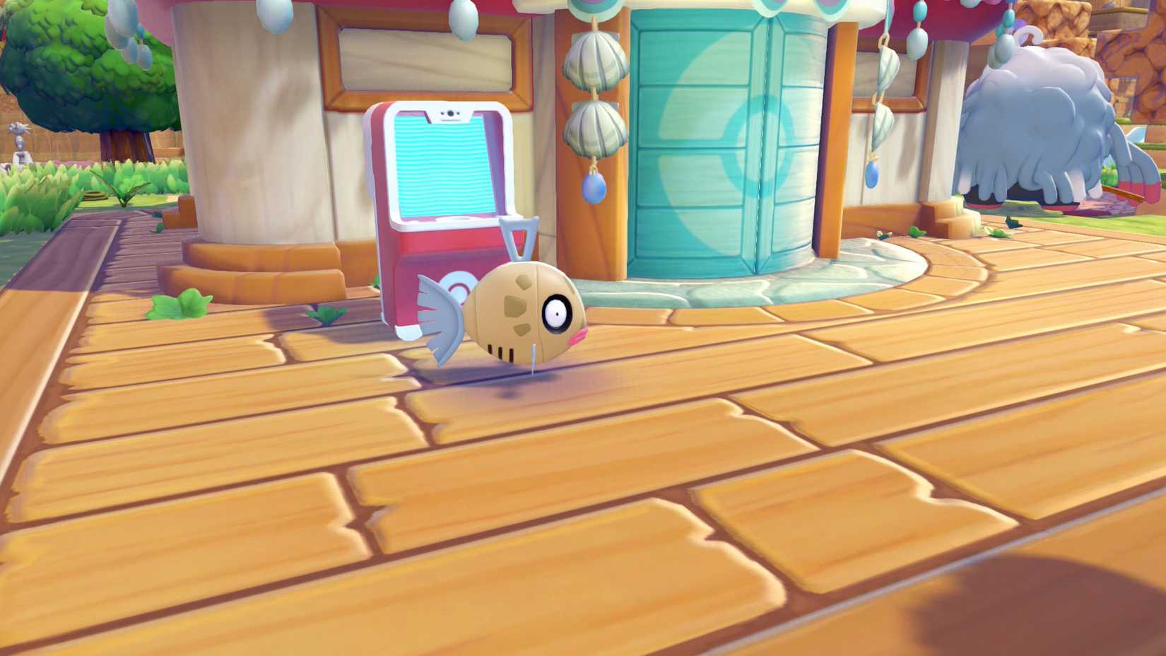A Pokémon Pokopia screenshot showing Feebas in front of a rebuilt Pokémon center