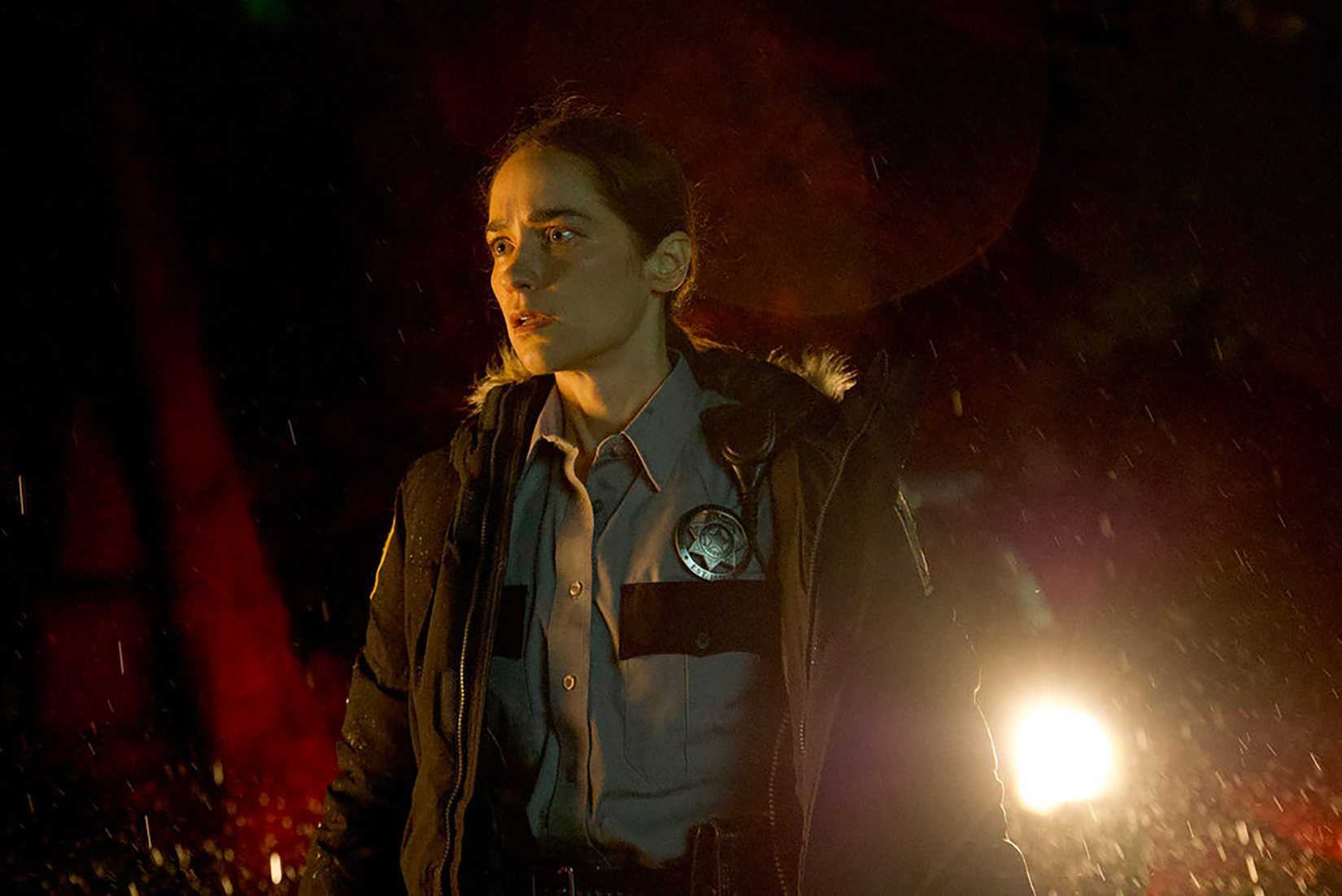 Melanie Scrofano wearing a cop outfit in Revival