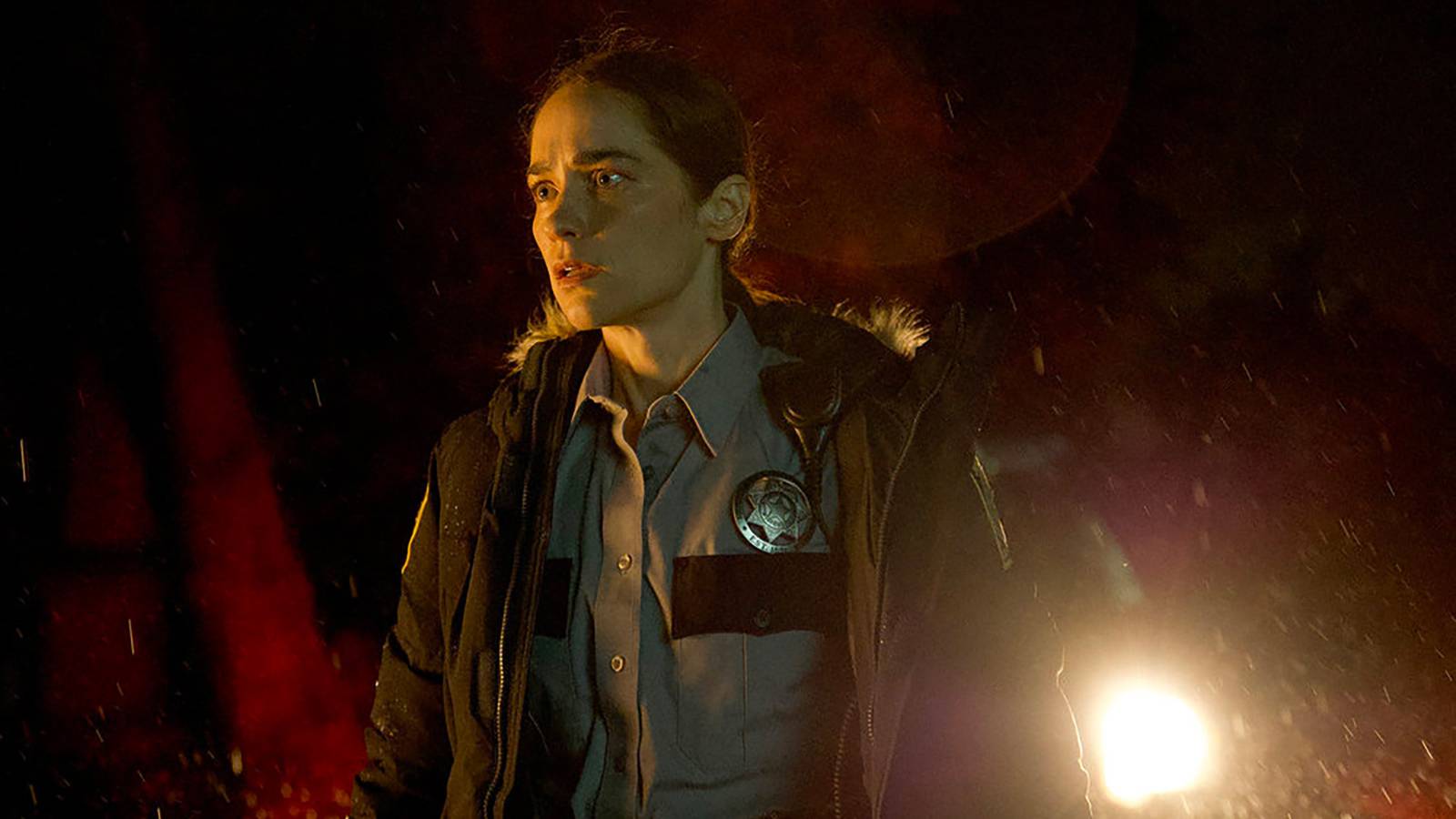 Melanie Scrofano wearing a cop outfit in Revival