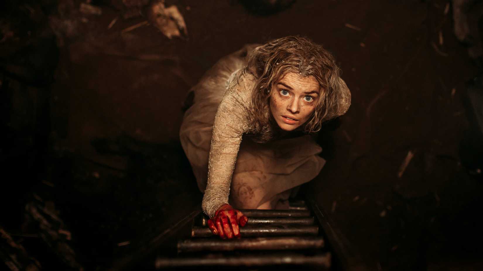 Grace climbs up a ladder in Ready or Not