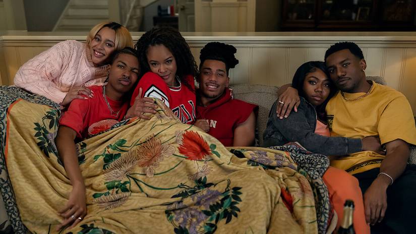 A group huddled together on the couch in A Different World
