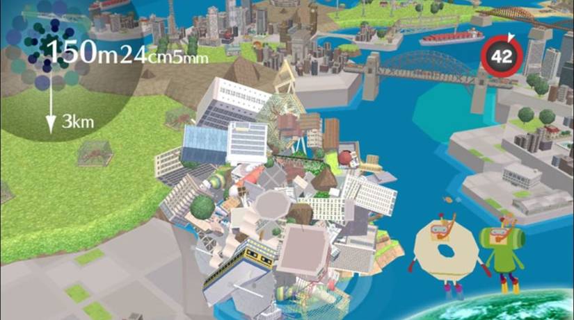 Beautiful Katamari screenshot - the Prince rolls a giant ball of objects along a river toward a small suspension bridge