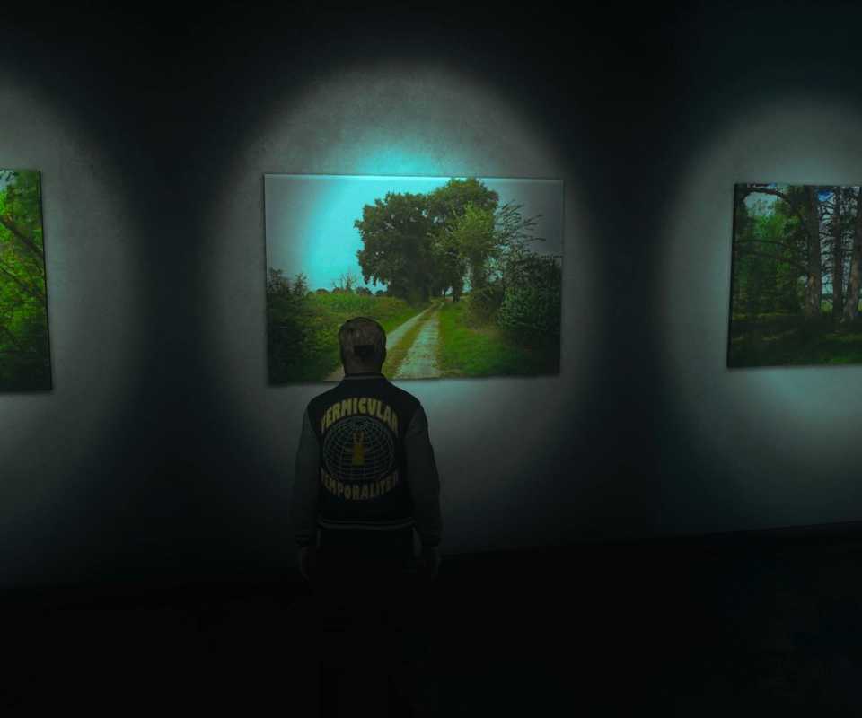 Dylan standing in front of the journey artwork in Control Resonant.