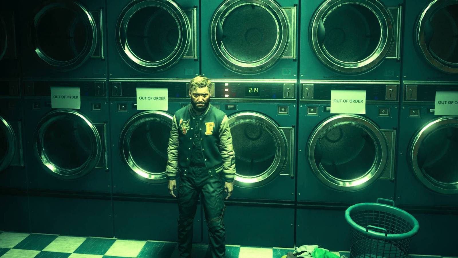 Dylan Faden standing next to the washing machines in the laundromat in Control Resonant.