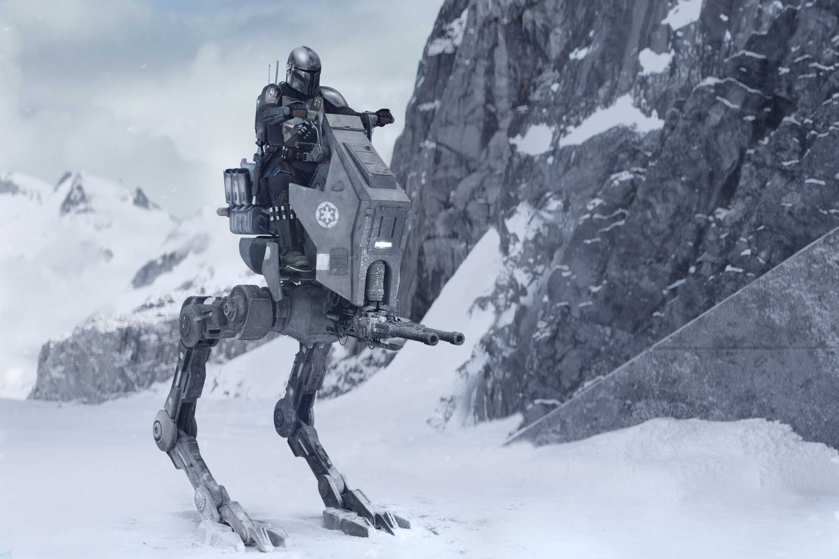 Din Djarin steers a walker on a snowy planet in The Mandalorian and Grogu