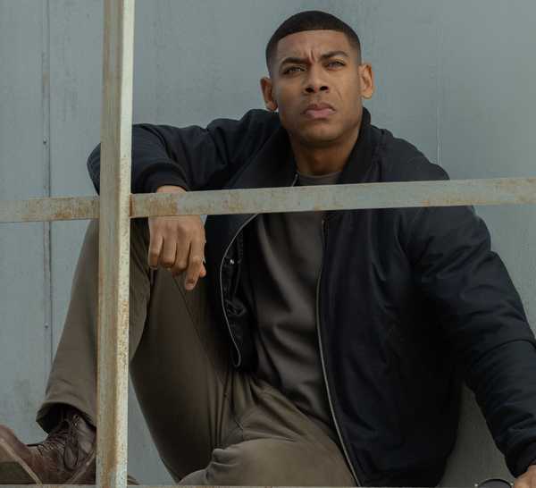 John Stewart (Aaron Pierre) sits in a tower in Lanterns