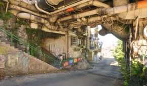 Graffiti lines a tunnel in No Law