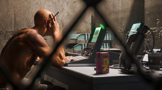 A man smokes a cigarette at a computer in No Law