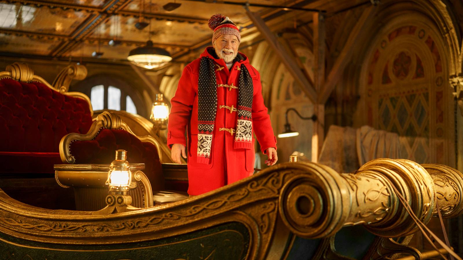 Santa (Arnold Schwarzenegger) stands in his sleigh in The Man with the Bag