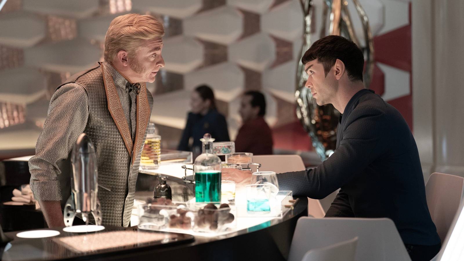 Trelane (Rhys Darby) serves Spock (Ethan Peck) a drink in Star Trek Strange New Worlds season 3
