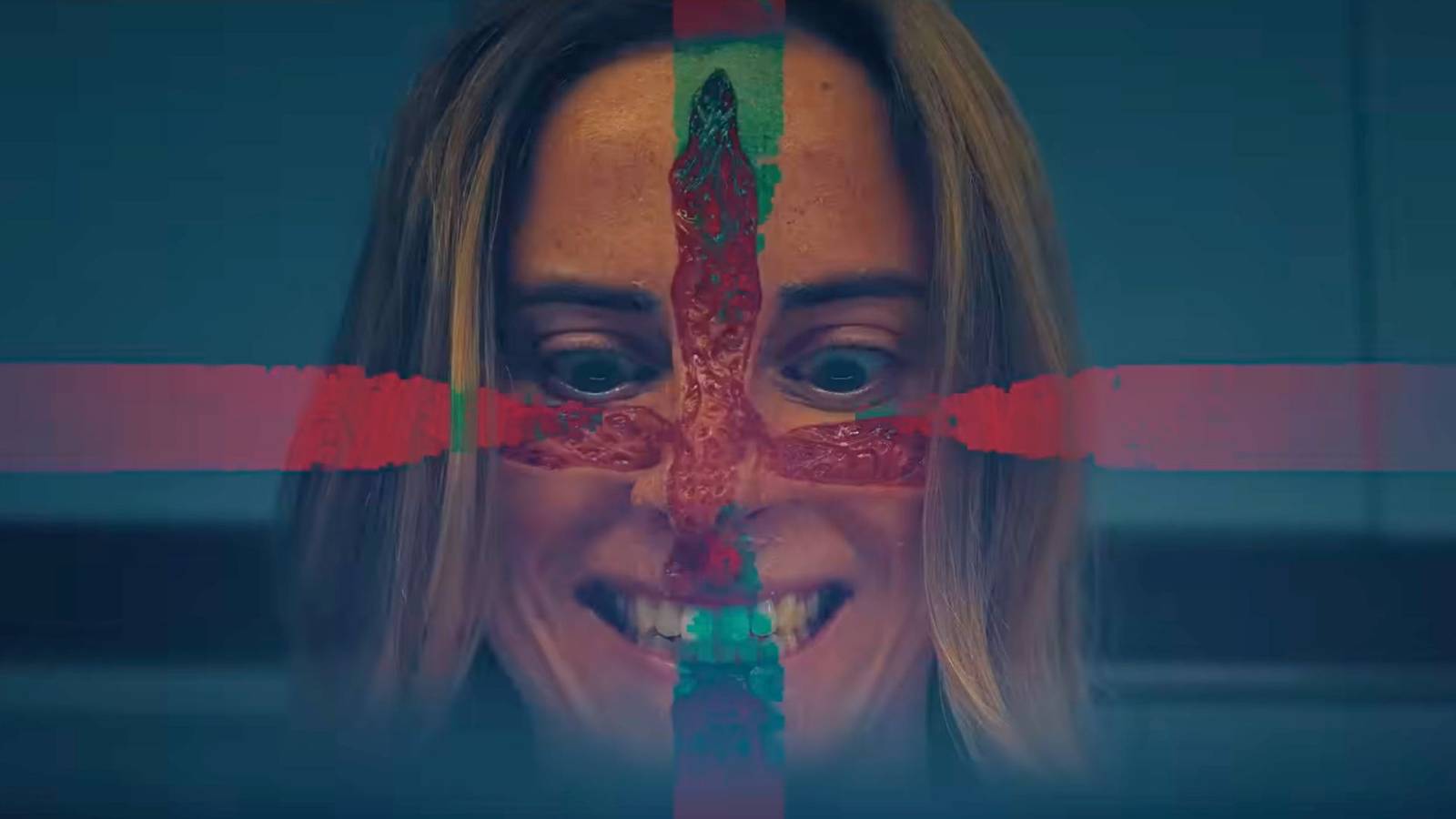 Image of a woman smiling with a red cross on her face