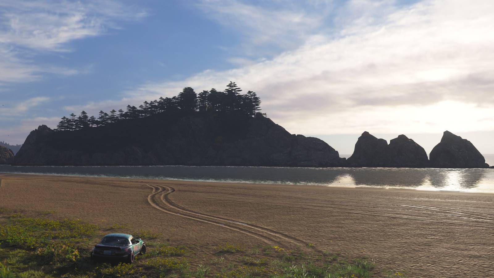 A car parked on Jodogohama Beach looking toward a rock formation off the coast in Forza Horizon 6.