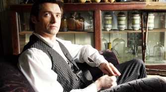 the prestige hugh jackman seated