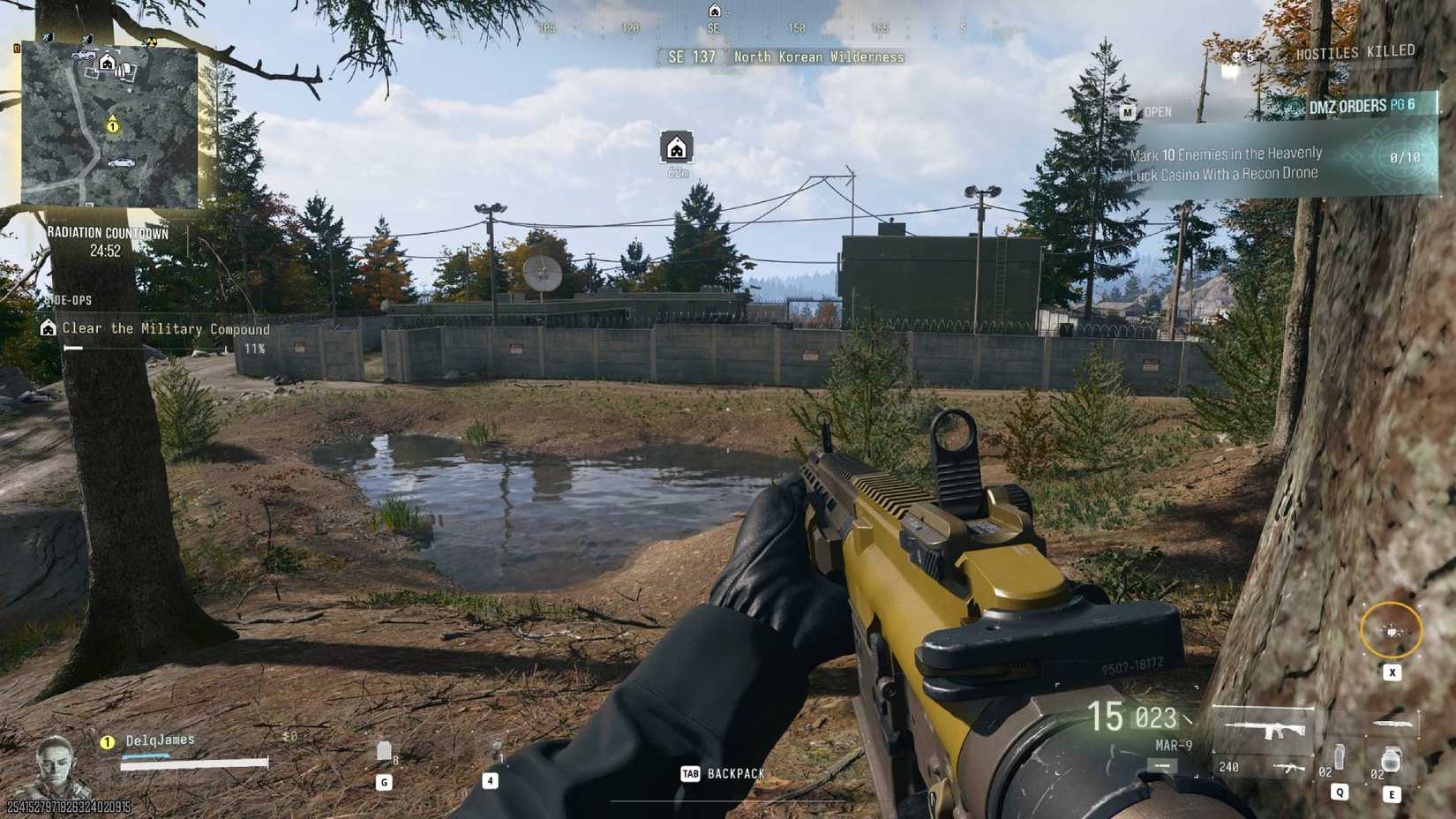 The player in DMZ looking at a compound from the outside.