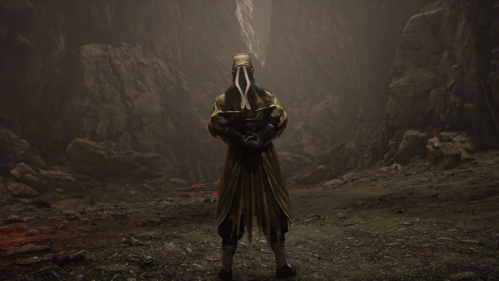 A Phantom Blade Zero screenshot showing a man wearing yellow clothes with his back to the camera