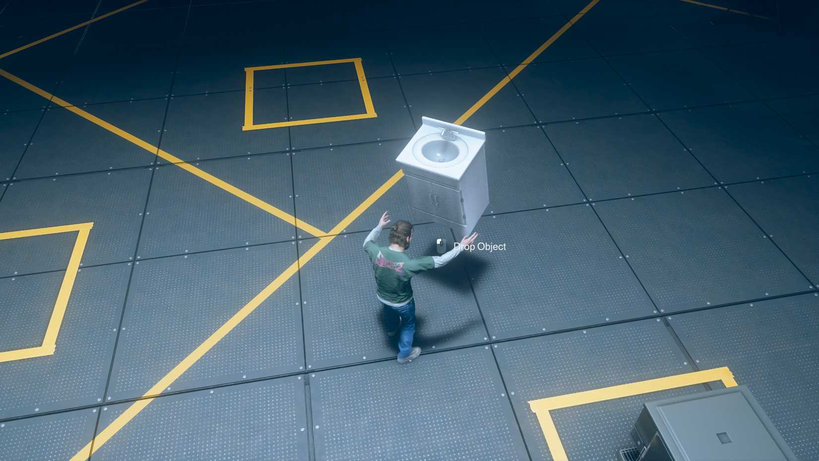 Dylan holding a sink in an area with yellow tape and squares in Control Resonant.