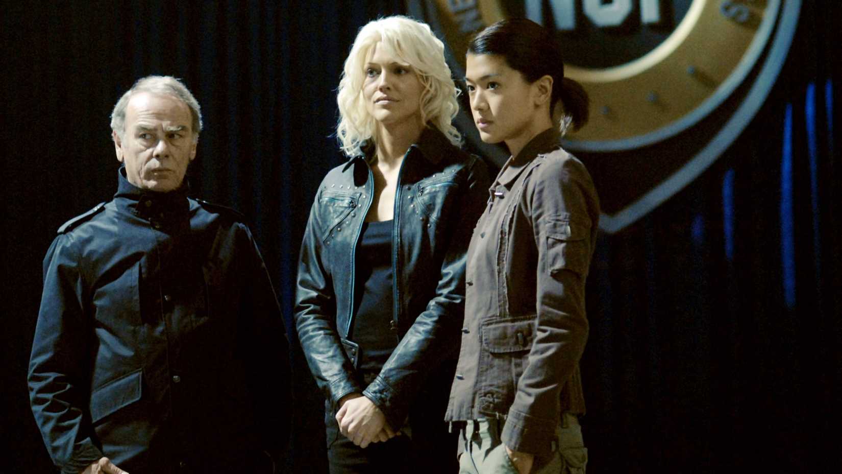 The Cylon leaders of New Caprica stand together in Battlestar Galactica