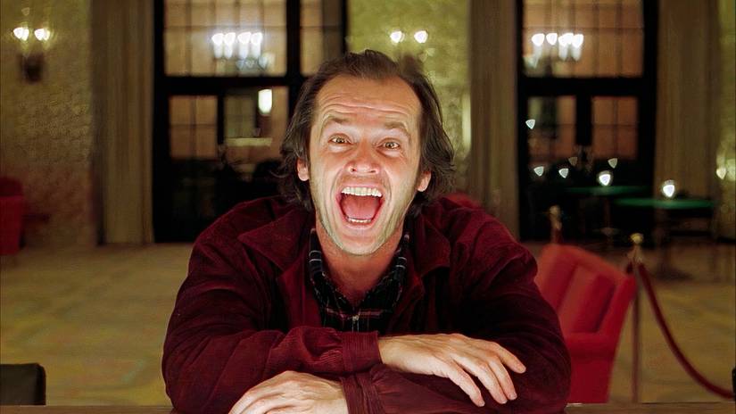 Jack laughs while talking to the bartender in The Shining