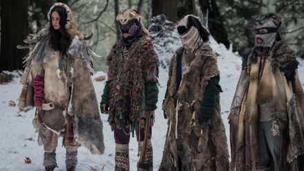 The Yellowjackets wearing furs and facemasks.