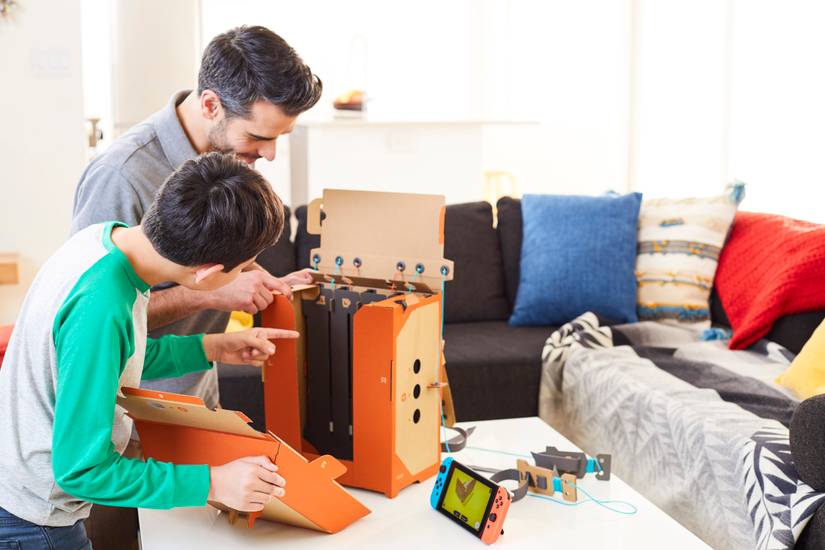Nintendo Labo - man and boy build robot suit backpack