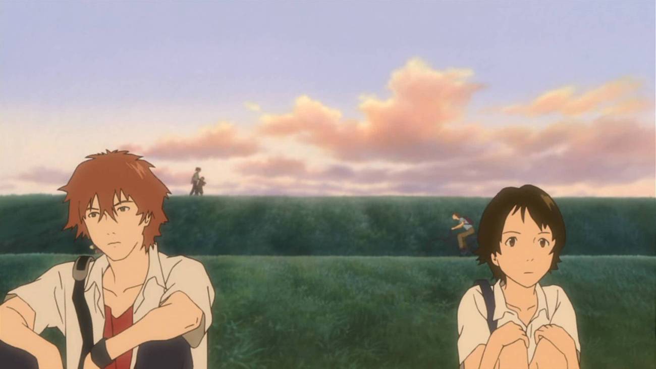 Two young adults sit next to each other with some distance between them in The Girl Who Leapt Through Time