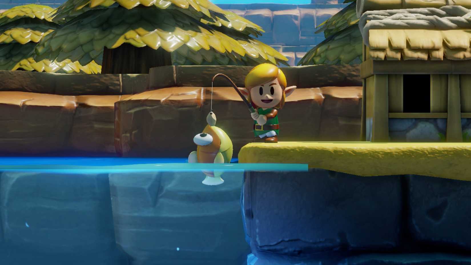 Link catches a fish in a screenshot from The Legend of Zelda: Link’s Awakening (2019)