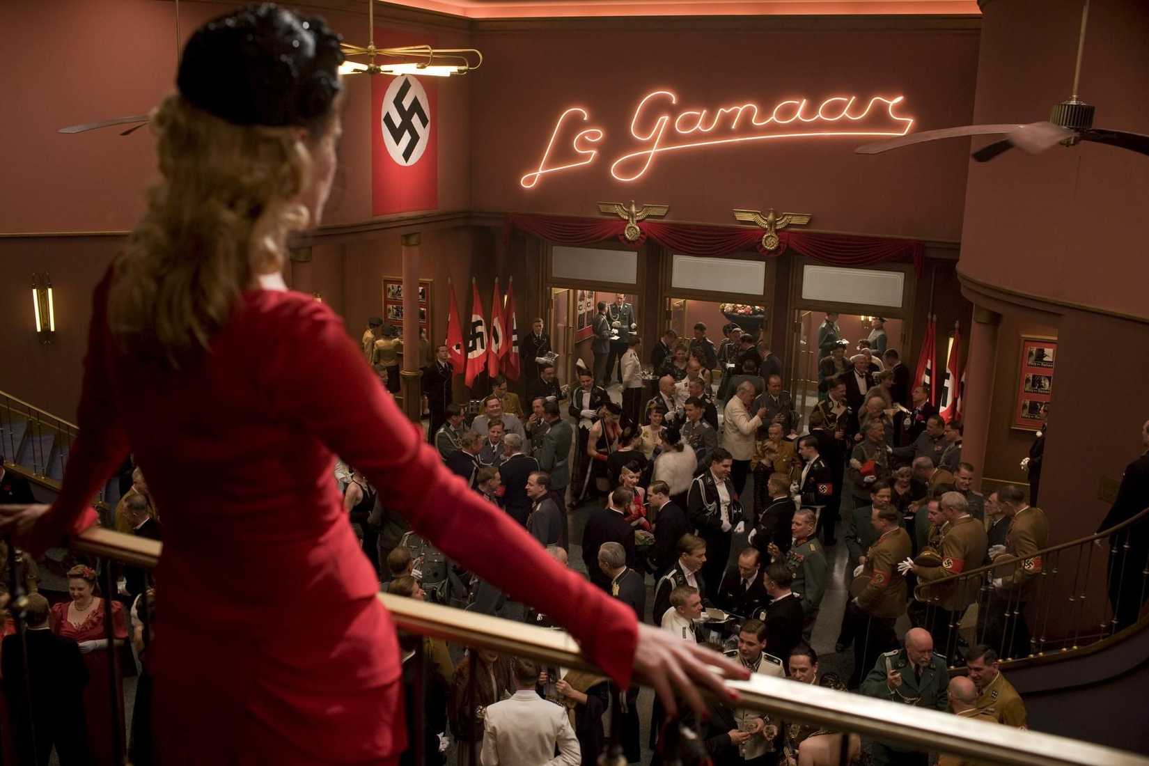 Shoshanna (Laurent) surveys an assembly of Nazis in her movie theater.