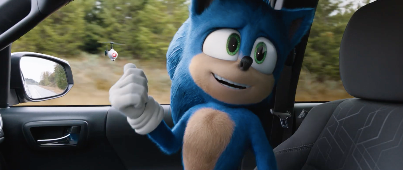 sonic the hedgehog (redesigned) looks at a drone floating outside a car window in Sonic the Hedgehog