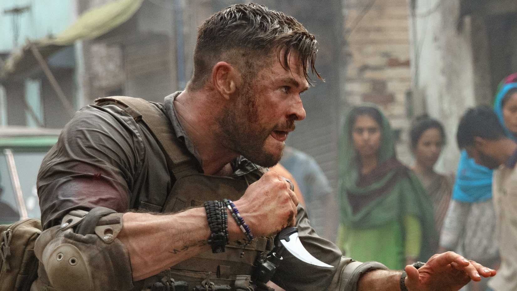 Chris Hemsworth holding a knife in Extraction