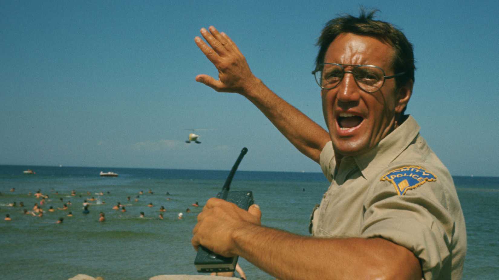 Police chief Roy Scheider yells a warning as he watches his island’s crowded beaches for any sign of a shark attack in Jaws.