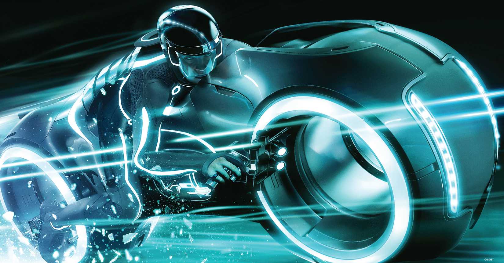Sam Flynn rides a blue-hued lightcycle with streaks of motion blur in a promotional still from Tron: Legacy